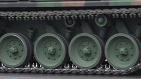 4K Closeup of military drill pass, tank machine transportation in front war combat by day - Powered by Shutterstock - Get 15% off with code: PIKWIZARD15
