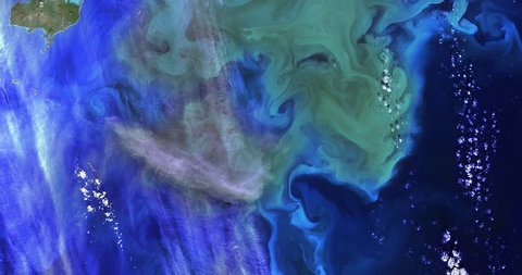High-altitude overflight aerial of phytoplankton bloom near Alaska's BeringSea. Clip loops and is reversible. Elements of this image furnished by NASA