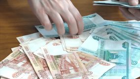 Female hands and Russian money
