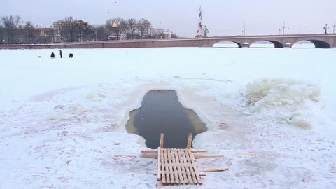 ST. PETERSBURG, RUSSIA - December 2, 2015: ice hole in the river Neva on a background of the Troitsky Bridge. 