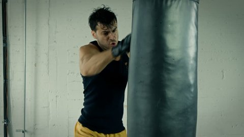 Athletic Male Working Out. Boxing. Slow Motion.