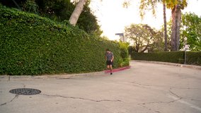 Athletic male running in the street. Slow motion.