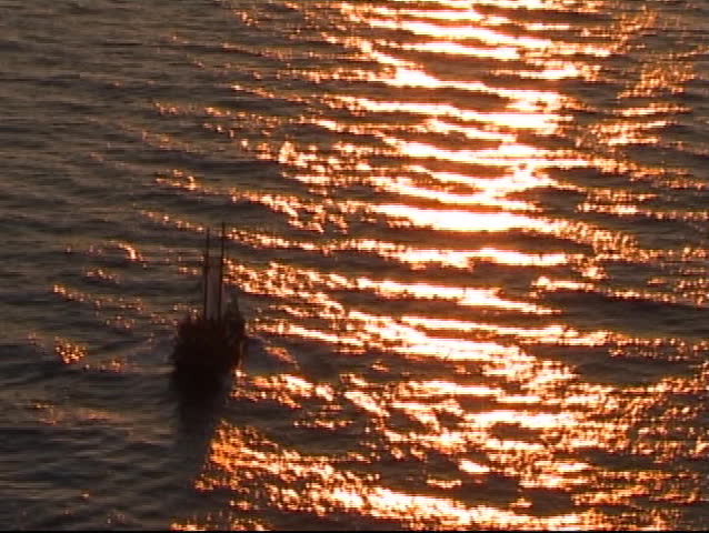 sailing ship at sunset