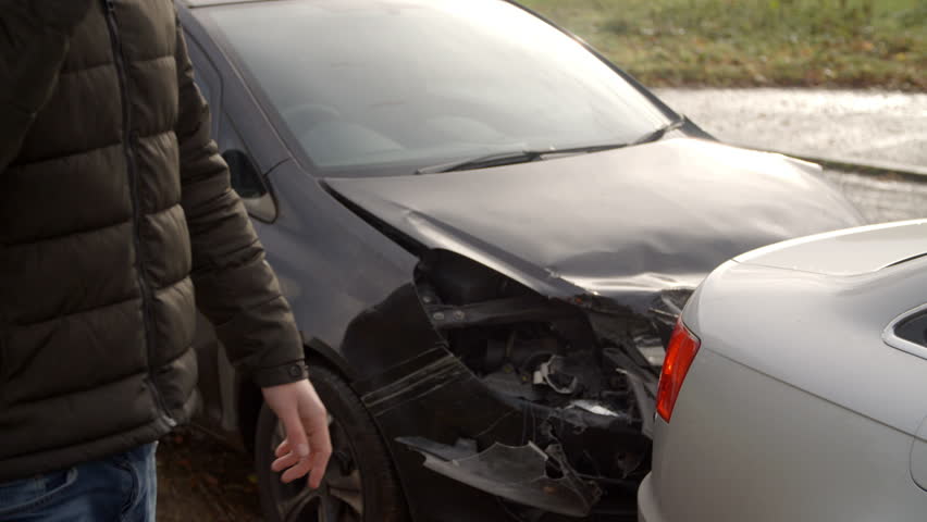 Man Calling To Report Car Accident On Country Road
