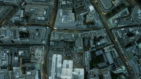 Aerial overhead rooftop view of business and financial buildings in inner city London England  