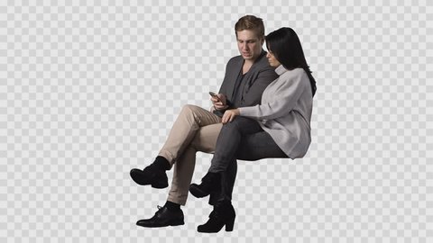 Handsome man & young female are sitting together and looking at smartphone. Footage with alpha channel. File format - mov. Codec - PNG+Alpha