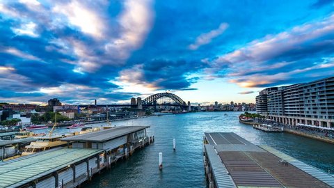 SYDNEY, AUSTRALIA - SEPTEMBER 02, 2016: View of sunset from Circular Quay Harbour with cloud and ferry timelapse movement in 4k resolution.