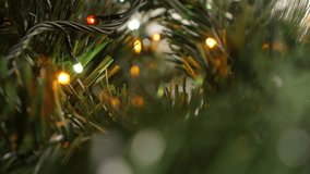 Christmas Eve and Day tree celebrating decoration close-up 2160p 30fps UltraHD footage - Colorful dot lights blinking in dark shallow DOF 4K 3840X2160 UHD video