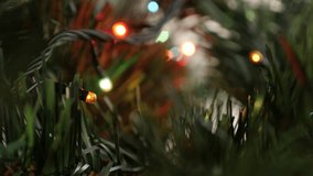 Shallow DOF colorful dot lights blinking in dark 4K 2160p 30fps UltraHD footage - Close-up of Christmas Eve and Day tree celebrating decoration 3840X2160 UHD video