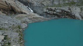 aerial 4K video  of Briksdalsbreen glacier, Norway with flight close to the glacier and above Briksdalsbrevatnet lake,  captured by professional drone camera