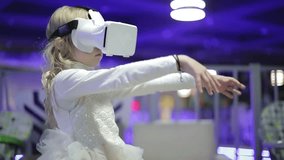Schoolgirl using virtual reality glasses in the entertainment center. Little girl trying a new gadget. - Powered by Shutterstock - Get 15% off with code: PIKWIZARD15