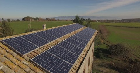 Solar panels on an ancient country house Italy. Country landscape .