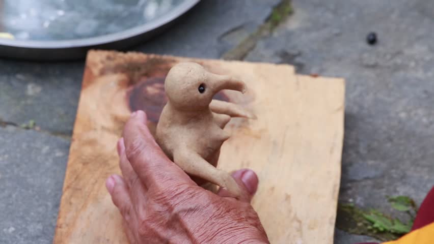 Tibetan monk sculpted figure of the deity of barley flour tsampa for Buddhist religious ceremony in Nepal. Close up