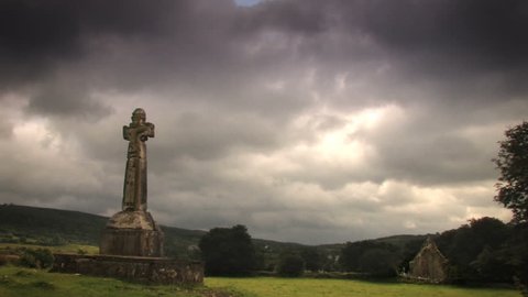Celtic cross and monastery with timelapse sky 1080HD