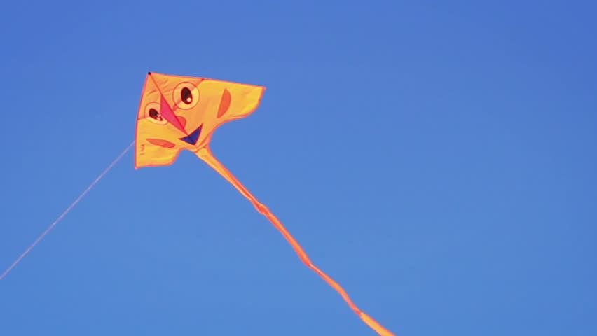 A kite flying in the blue sky
