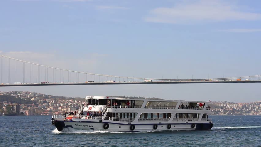ISTANBUL - APRIL 7: Y.Yesil Ada ship sails under Bosporus Bridge on April 7,