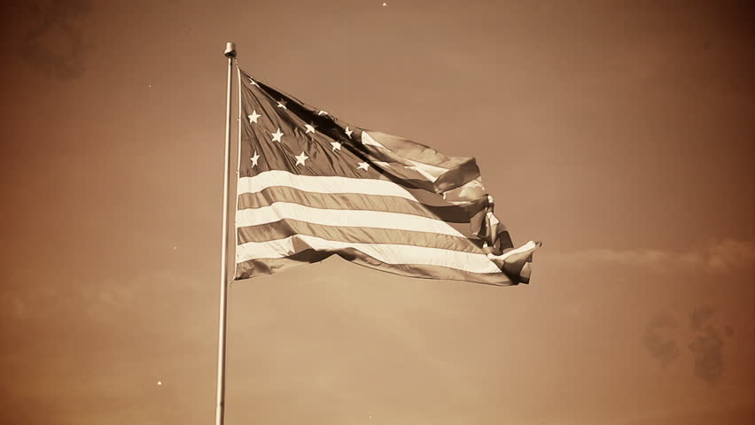 A simulated old-style film of a 13-star American flag.
