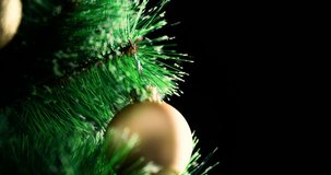 Decorated Christmas tree with baubles rotation 4k extreme close-up looped video background with copy space. Merry Christmas and Happy New year greeting card template