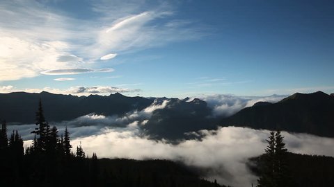Time lapse cloud layer on Mount Rainier in Washington, USA at morning light high above