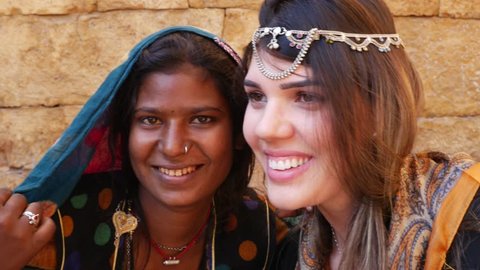 Tourist taking photos with Rajasthani traditional woman, Jaisalmer, India