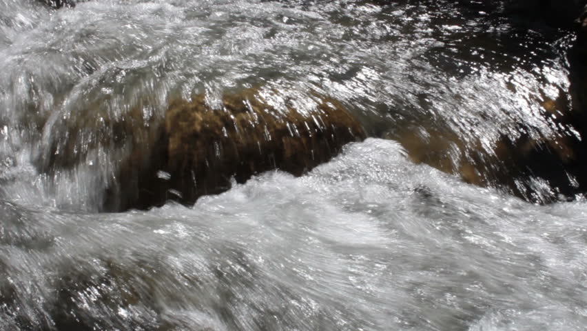 Raging river rapids on stones/Raging river