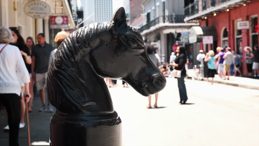 Vintage horsehead hitching post on Bourbon Street in the historic French Quarter of New Orleans