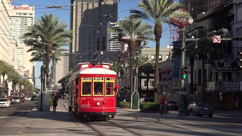 NEW ORLEANS, LOUISIANA - MAY 6th: Traffic and Streetcars on Canal Street in downtown New Orleans, Louisiana on May 6th, 2016.