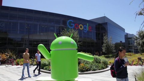 Mountain View, California, USA - August 15, 2016: Android robot statue at Google entrance of its colorful building complex. Google is leader of Internet search engine services.