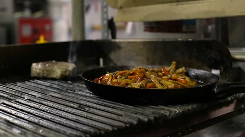 Cooking vegetables and chicken breast fillet in pan
