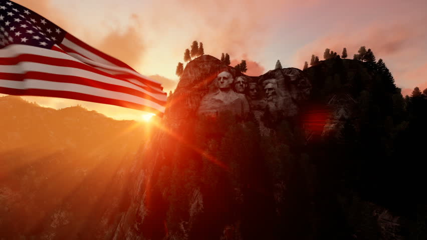 Mount Rushmore with USA Flag blowing in the wind, beautiful sunrise