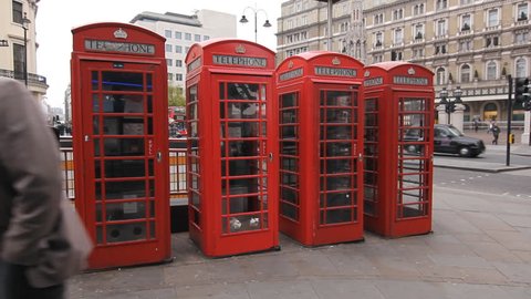 LONDON, UK - APRIL 4th: Telephone boxes at Strand and Duncannon streets, London on April 4th, 2012. The K6 model telephone box was introduced in 1936 to mark King George V’s 25th year on the throne.