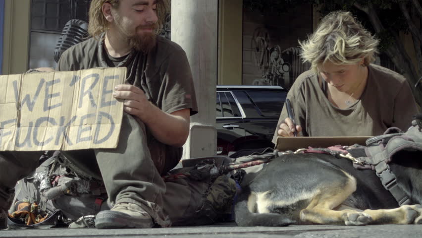 homeless couple writing signs dog squatting Stok Videosu (%100 Telifsiz) 22...