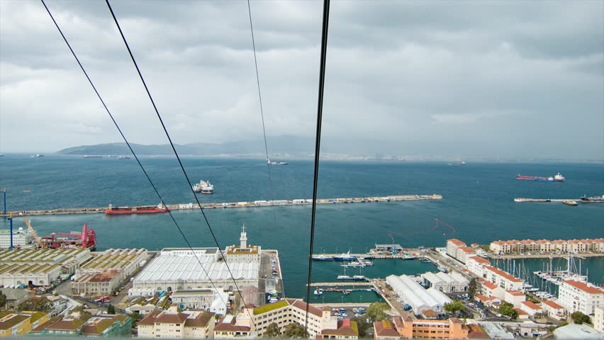 Onboard Gibraltar Cable Car Riding to the Top Upper Rock Nature Reserve looking Over the Bay on a Cloudy Day in the British Overseas Territory