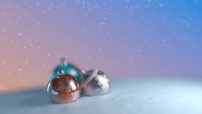 Snow falls on a Christmas background with Xmas ball. Blue, orange and silver bubbles on a background of snowflakes falling. Copy space at right side. HD 1080p 