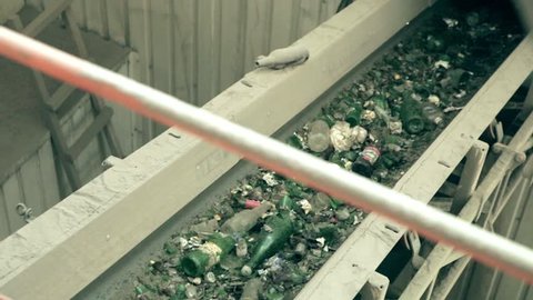 Conveyor belt and glass shredder equipment inside glass recycling factory