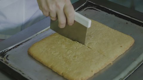 Slicing cooked biscuits