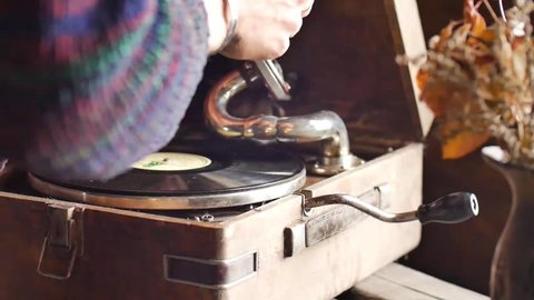 Male hand clean gramophone needle in slow motion