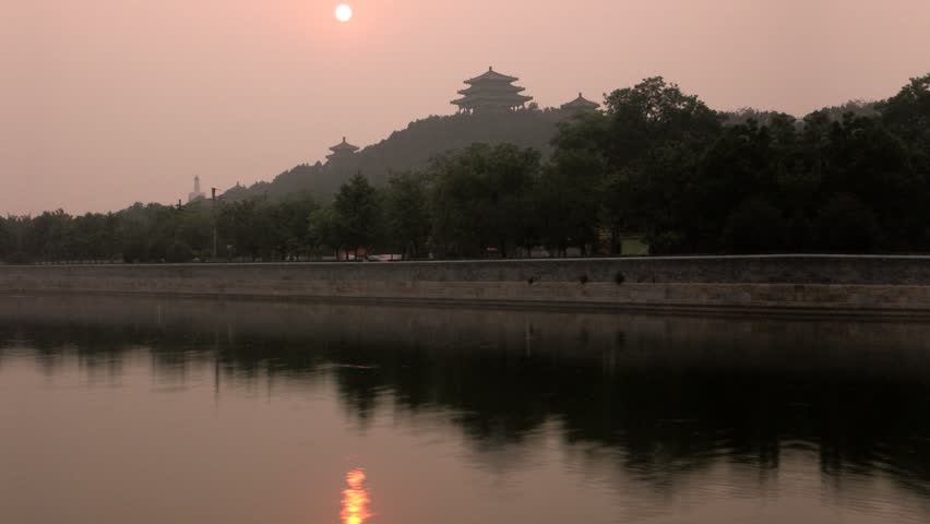 Timelapse of sunset with temples in Beijing, China.