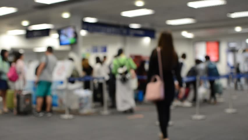 Defocus or Blur of People ( Man, Woman and Child ) on the Line to Airport Security  Check to Scan Luggage and Body before Departure Hall. Royalty-Free Stock Footage #22393951
