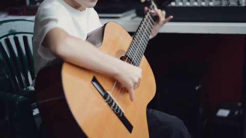 boy play guitar