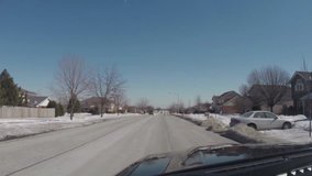 Driving car on roads during cold snowy winter day