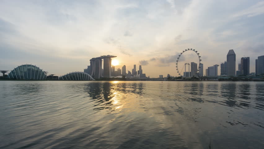 Beautiful Time lapse of Day to Night of Singapore skyline with reflection. 4K UHD. Zoom In Camera Motion. Royalty-Free Stock Footage #22410733
