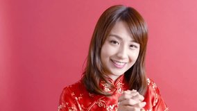 video of beauty woman wear cheongsam and smile to you in chinese new year