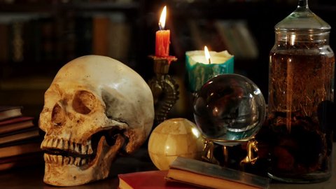 Occult Magic Desk (HD). Occult study setup desk with a skull, candles, crystal ball, books, and other occult paraphernalia. Skull is resin replica not real