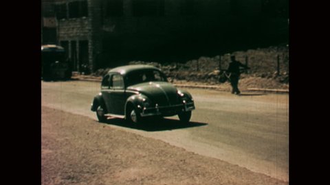 NAZARETH, ISRAEL: 1960s: VW car drives through street in Nazareth.