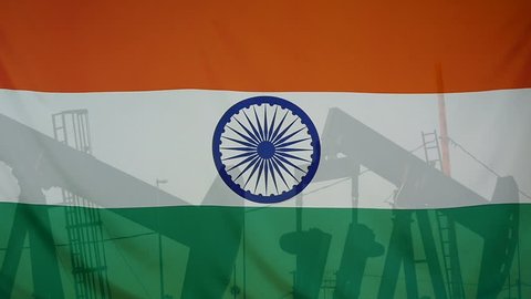 Concept oil production in India oil pumps and indian flag in slow motion movement