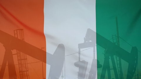 Concept oil production in Ivory Coast oil pumps and Cote d'Ivoire flag in slow motion movement