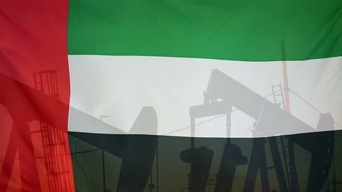 Concept oil production in U.A.E oil pumps and flag in slow motion movement