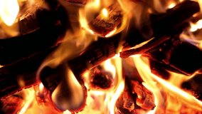 A looping clip of a fireplace with medium size flames. the dying embers in the fireplace. FHD.