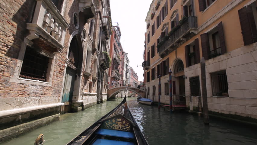 CIRCA 2011: BOAT POV WS Gondola Floating down Narrow Canal / Venice, Italy
